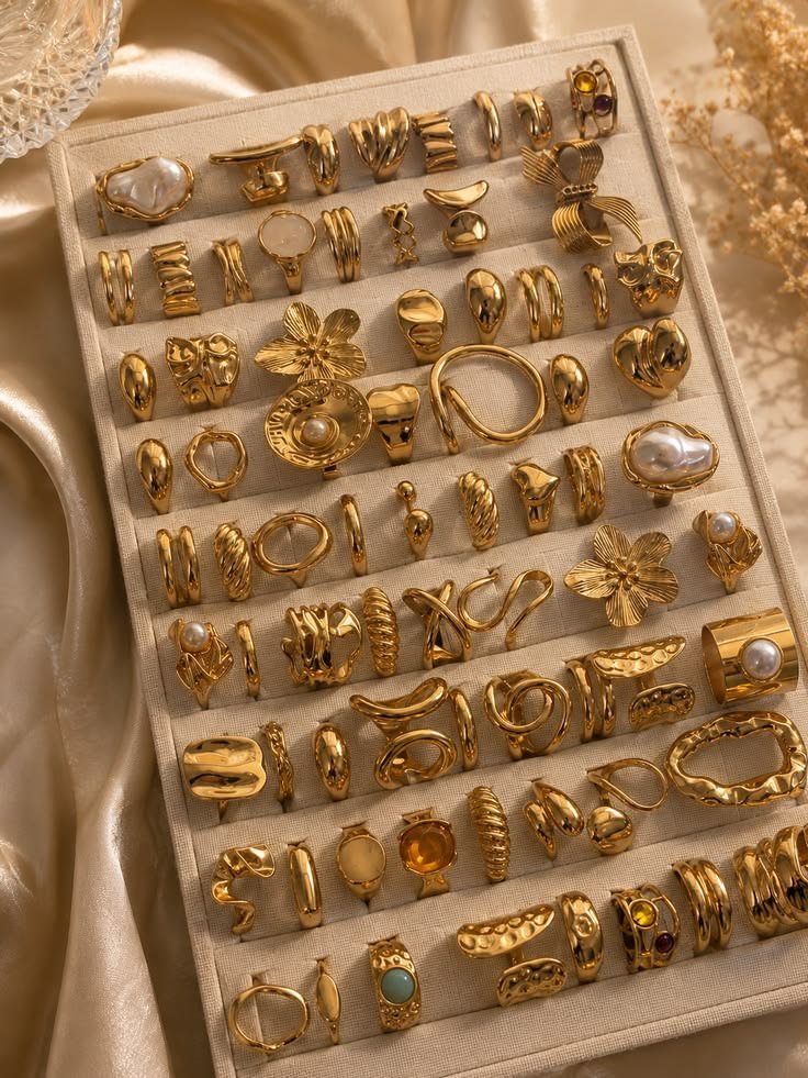 Gold-plated vintage flower and geometric chunky rings set on a ring tray